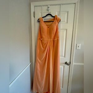 Tangerine/peach colored sleeveless cowl neck bridesmaid dress